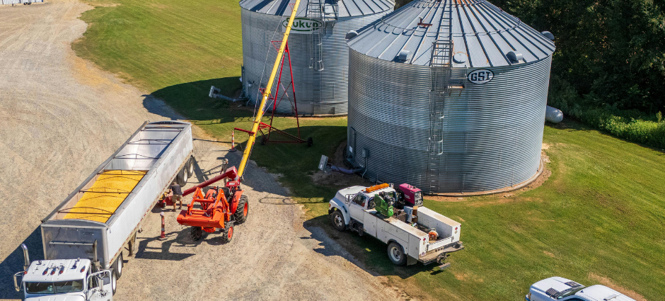 grain bins being filled with corn